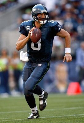SEATTLE - SEPTEMBER 13:  Quarterback Matt Hasselbeck #8 of the Seattle Seahawks with the ball against the St. Louis Rams at Qwest Field on September 13, 2009 in Seattle, Washington.  (Photo by Jonathan Ferrey/Getty Images)