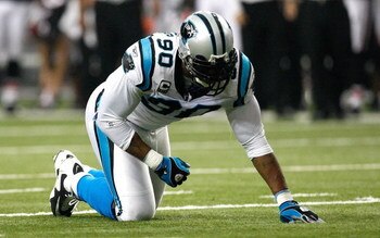 ATLANTA - SEPTEMBER 20:  Julius Peppers #90 of the Carolina Panthers is slow to get up against the Atlanta Falcons at Georgia Dome on September 20, 2009 in Atlanta, Georgia.  (Photo by Kevin C. Cox/Getty Images)
