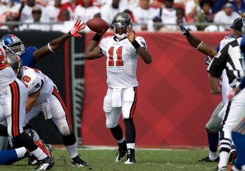 TAMPA, FL - SEPTEMBER 27:  Quarterback Josh Johnson #11 of the Tampa Bay Buccaneers looks for an open receiver against the New York Giants during the game at Raymond James Stadium on September 27, 2009 in Tampa, Florida.  (Photo by J. Meric/Getty Images)