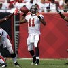 TAMPA, FL - SEPTEMBER 27:  Quarterback Josh Johnson #11 of the Tampa Bay Buccaneers looks for an open receiver against the New York Giants during the game at Raymond James Stadium on September 27, 2009 in Tampa, Florida.  (Photo by J. Meric/Getty Images)