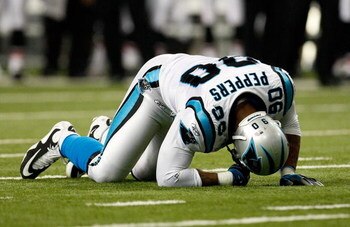 ATLANTA - SEPTEMBER 20:  Julius Peppers #90 of the Carolina Panthers is slow to get up against the Atlanta Falcons at Georgia Dome on September 20, 2009 in Atlanta, Georgia.  (Photo by Kevin C. Cox/Getty Images)