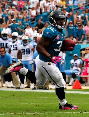 JACKSONVILLE, FL - OCTOBER 04:  Maurice Jones-Drew #32 runs for a touchdown during the game against the Tennessee Titans at Jacksonville Municipal Stadium on October 4, 2009 in Jacksonville, Florida. Many players and officials in the NFL wore pink as part
