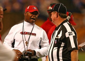MINNEAPOLIS - SEPTEMBER 27: Head coach Mike Singletary of the San Francisco 49ers argues with Head Linesman John Schleyer #21 during a game against the Minnesota Vikings at the Hubert H. Humphrey Metrodome on September 27, 2009 in Minneapolis, Minnesota. 