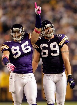 MINNEAPOLIS - OCTOBER 05:  Defensive ends Brian Robinson #96 and Jared Allen #69 of the Minnesota Vikings celebrate during the Monday Night Football game against the Green Bay Packers on October 5, 2009 at Hubert H. Humphrey Metrodome in Minneapolis, Minn