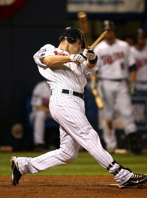 MINNEAPOLIS - OCTOBER 11: Joe Mauer #7 of the Minnesota Twins shatters his bat hitting against the New York Yankees in Game Three of the ALDS during the 2009 MLB Playoffs at the Hubert H. Humphrey Metrodome on October 11, 2009 in Minneapolis, Minnesota. (