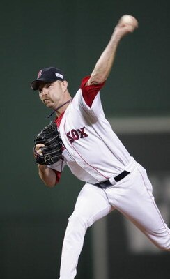 BOSTON - OCTOBER 23:  Alan Embree #43 of the Boston Red Sox pitches against the St. Louis Cardinals during game one of the 2004 World Series on October 23, 2004 at Fenway Park in Boston, Massachusetts. (Photo by Elsa/Getty Images)