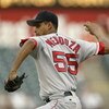 ARLINGTON, TEXAS - JULY 30:  Pitcher Ramiro Mendoza #55 of the Boston Red Sox delivers a pitch during the American League game against the Texas Rangers at the Ballpark in Arlington on July 30, 2003 in Arlington, Texas.  The Rangers defeated the Red Sox 9