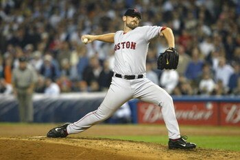 BRONX, NY - OCTOBER 8:  Pitcher Scott Williamson #48 of the Boston Red Sox pitches against the New York Yankees during game 1 of the American League Championship Series on October 8, 2003 at Yankee Stadium in the Bronx, New York.  The Red Sox won 5-2 as W