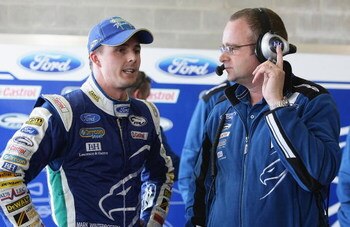 BATHURST, AUSTRALIA - OCTOBER 10:  Tim Edwards team principal for Ford Performance Racing talks with driver Mark Winterbottom after his qualifying lap during qualifying for the Bathurst 1000, which is round 10 of the V8 Supercars Championship Series at Mo