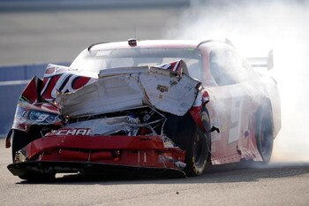 FONTANA, CA - OCTOBER 11:  Kasey Kahne, driver of the #9 Budweiser Dodge, drives down pit road after a multi-car incident during the NASCAR Sprint Cup Series Pepsi 500 at Auto Club Speedway on October 11, 2009 in Fontana, California.  (Photo by Rusty Jarr