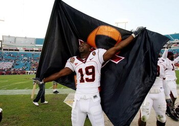 JACKSONVILLE, FL - DECEMBER 1:  Split end Josh Hyman #19 of the Virginia Tech Hokies celebrates with a Virginia Tech flag after defeating the Boston College Eagles in the ACC Championship Game at Jacksonville Municipal Stadium December 1, 2007 in Jacksonv