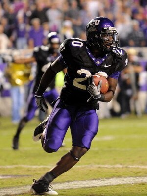 FORT WORTH, TX - OCTOBER 16:  Cornerback Nick Sanders #20 of the TCU Horned Frogs makes a pass interception in the endzone against Austin Collie #9 of the BYU Cougars at Amon G. Carter Stadium on October 16, 2008 in Fort Worth, Texas.  (Photo by Ronald Ma