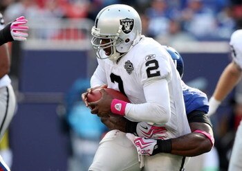 EAST RUTHERFORD, NJ - OCTOBER 11:  Justin Tuck #91 of the New York Giants sacks JaMarcus Russell #2 of the Oakland Raiders in the third quarter on October 11, 2009 at Giants Stadium in East Rutherford, New Jersey. The Giants defeated the Raiders 44-7.  (P