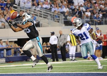 ARLINGTON, TX - SEPTEMBER 28:  Dante Rosario #88 of the Carolina Panthers catches a touchdown pass over Mike Jenkins #21 of the Dallas Cowboys at Cowboys Stadium on September 28, 2009 in Arlington, Texas. (Photo by Ronald Martinez/Getty Images)