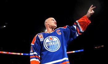 EDMONTON, CANADA - FEBRUARY 27:  Former Edmonton Oilers great Mark Messier #11 salutes his fans as he takes a final skate around the ice during a ceremony to raise his #11 banner to the rafters of Rexall Place prior to the Oilers game against the Phoenix 