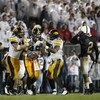 STATE COLLEGE, PA - SEPTEMBER 26:  A.J. Edds #49 of the Iowa Hawkeyes celebrates a fourth quarter interception with Pat Angerer #43 and Jeremiha Hunter #42 in front of Chaz Powell #2 of the Penn State Nittnay Lions  on September 26, 2009 at Beaver Stadium