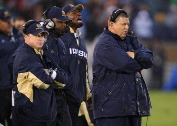 SOUTH BEND, IN - OCTOBER 03: Head coach Charlie Weis of the Notre Dame Fighting Irish and his staff watch as their team takes on the Washington Huskies on October 3, 2009 at Notre Dame Stadium in South Bend, Indiana. Notre Dame defeated Washington 37-30 i