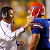 BATON ROUGE, LA - OCTOBER 10:  Head coach Urban Meyer (L) talks with quarterback Tim Tebow #15 of the Florida Gators during the game against the Louisiana State University Tigers at Tiger Stadium on October 10, 2009 in Baton Rouge, Louisiana.  (Photo by K