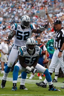 CHARLOTTE, NC - SEPTEMBER 14:  Thomas Davis #58 and teammate Jon Beason #52 of the Carolina Panthers celebrate after a defensive stop against the Chicago Bears during their game at Bank of America Stadium on September 14, 2008 in Charlotte, North Carolina