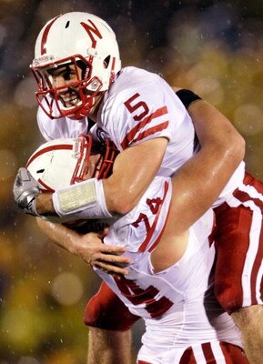COLUMBIA, MO - OCTOBER 08:  Quarterback Zac Lee #5 of the Nebraska Cornhuskers jumps into the arms of Ricky Henry #74 after scoring a touchdown during the game against the Missouri Tigers on October 8, 2009 at Faurot Field/Memorial Stadium in Columbia, Mi