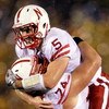 COLUMBIA, MO - OCTOBER 08:  Quarterback Zac Lee #5 of the Nebraska Cornhuskers jumps into the arms of Ricky Henry #74 after scoring a touchdown during the game against the Missouri Tigers on October 8, 2009 at Faurot Field/Memorial Stadium in Columbia, Mi