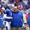 LAWRENCE, KS - OCTOBER 10:  Quarterback Todd Reesing #5 of the Kansas Jayhawks puts his arm around head coach Mark Mangino after rushing for a touchdown during the game against the Iowa State Cyclones on October 10, 2009 at Memorial Stadium in Lawrence, K