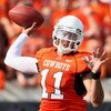 STILLWATER, OK - SEPTEMBER 05:  Quarterback Zac Robinson #11 of the Oklahoma State Cowboys throws a pass during the college football game against the Georgia Bulldogs at Boone Pickens Stadium on September 5, 2009 in Stillwater, Oklahoma.  The Cowboys defe