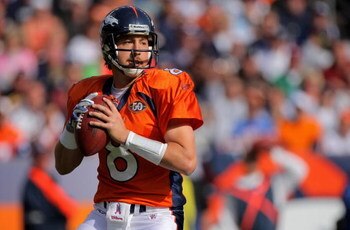 DENVER - OCTOBER 04:  Quarterback Kyle Orton #8 of the Denver Broncos drops back to pass against the Dallas Cowboys during NFL action at Invesco Field at Mile High on October 4, 2009 in Denver, Colorado. The Broncos defeated the Cowboys 17-10.  (Photo by 