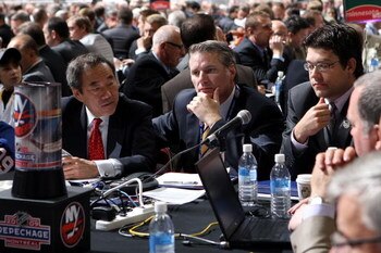 MONTREAL , QC - JUNE 27:  General Manager Garth Snow of the New York Islanders (C) and assistant General Manager Ryan Jankowski (R) sit at the draft table during the second day of the 2009 NHL Entry Draft at the Bell Centre on June 27, 2009 in Montreal, Q