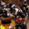 PITTSBURGH - JANUARY 18:  Ike Taylor #24 and Troy Polamalu #43 of the Pittsburgh Steelers tackle Derrick Mason #85 of the Baltimore Ravens during the AFC Championship game on January 18, 2009 at Heinz Field in Pittsburgh, Pennsylvania.  (Photo by Streeter