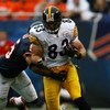 CHICAGO - SEPTEMBER 20: Heath Miller #83 of the Pittsburgh Steelers slips past Lance Briggs #55 of the Chicago Bears on September 20, 2009 at Soldier Field in Chicago, Illinois. The Bears defeated the Steelers 17-14. (Photo by Jonathan Daniel/Getty Images