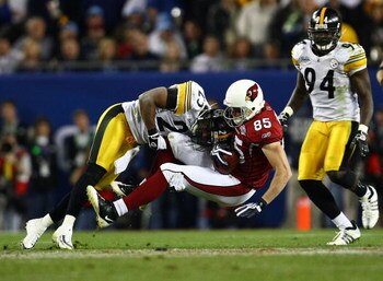 TAMPA, FL - FEBRUARY 01:  Jerheme Urban #85 of the Arizona Cardinals makes a reception in the fourth quarter as he is hit by Ryan Clark #25 of the Pittsburgh Steelers during Super Bowl XLIII on February 1, 2009 at Raymond James Stadium in Tampa, Florida. 