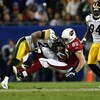 TAMPA, FL - FEBRUARY 01:  Jerheme Urban #85 of the Arizona Cardinals makes a reception in the fourth quarter as he is hit by Ryan Clark #25 of the Pittsburgh Steelers during Super Bowl XLIII on February 1, 2009 at Raymond James Stadium in Tampa, Florida. 