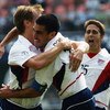 JEONJU - JUNE 17:  Brian McBride of the USA celebrates his goal with team mate Claudio Reyna during the Mexico v USA, World Cup Second Round match played at the Jeonju World Cup Stadium, Jeonju, South Korea on June 17, 2002. The USA won 2-0. (Photo by Chu