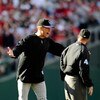 PHILADELPHIA - OCTOBER 07:  Manager Jim Tracy (L) of the Colorado Rockies argues with second base umpire Jerry Meals after he felt Cliff Lee #34 of the Philadelphia Phillies should of been called out on a pickoff attempt at second base in the bottom of th