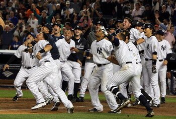 NEW YORK - OCTOBER 09:  The New York Yankees celebrate Mark Teixeira's (not pictured) walk off home run in the eleventh inning against the Minnesota Twins in Game Two of the ALDS during the 2009 MLB Playoffs at Yankee Stadium on October 9, 2009 in the Bro