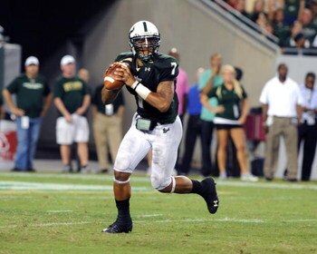 TAMPA, FL - OCTOBER 15: Quarterback B.J. Daniels #7 of the University of South Florida Bulls looks to pass against the Cincinnati Bearcats October 15, 2009 at Raymond James Stadium in Tampa, Florida.  (Photo by Al Messerschmidt/Getty Images)