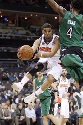 CHARLOTTE, NC - MARCH 16:  D.J. Augustin #14 of the Charlotte Bobcats drives to the basket against the Toronto Raptors during their game at Time Warner Cable Arena on March 16, 2009 in Charlotte, North Carolina.  NOTE TO USER: User expressly acknowledges 