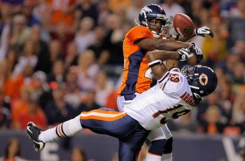 DENVER - AUGUST 30:  Cornerback Andre Goodman #21 of the Denver Broncos breaks up a pass intended for wide reciever Devin Aromashodu #19 of the Chicago Bears during preseason NFL action at INVESCO Field at Mile High on August 30, 2009 in Denver, Colorado.