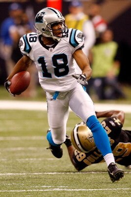 NEW ORLEANS - DECEMBER 28:  D.J. Hackett #18 of the Carolina Panthers avoids a tackle by Josh Bullocks #29 of the New Orleans Saints on December 28, 2008 at the Superdome in New Orleans, Louisiana. The Panthers defated the Saints 33-31.  (Photo by Chris G