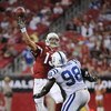 GLENDALE, AZ - SEPTEMBER 27:  Kurt Warner #13 of the Arizona Cardinals  throws as he is rushed by Robert Mathis #98 of the Indianapolis Colts during the game at University of Phoenix Stadium on September 27, 2009 in Glendale, Arizona.  (Photo by Harry How