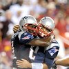 LANDOVER, MD - AUGUST 28:  Tom Brady #12 and Randy Moss #81 of the New England Patriots celebrate after scoring a touchdown in the second quarter of a preseason game against the Washington Redskins at FedExField on August 28, 2009 in Landover, Maryland.  