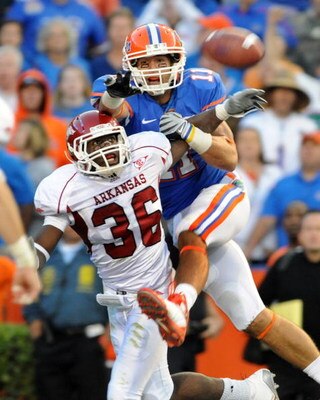 GAINESVILLE, FL - OCTOBER 17: Cornerback Andru Stewart #36 of the Arkansas Razorbacks breaks up a pass to wide receiver Riley Cooper #11 of the Florida Gators October 17, 2009 at Ben Hill Griffin Stadium in Gainesville, Florida.  (Photo by Al Messerschmid