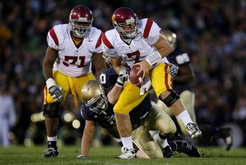 SOUTH BEND, IN - OCTOBER 17:  Quarterback Matt Barkley #7 of the USC Trojans is sacked by the Notre Dame Fighting Irish during the fourth quarter of the game at Notre Dame Stadium on October 17, 2009 in South Bend, Indiana. USC won the game 34-27. (Photo 