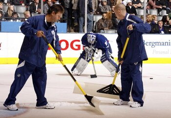 TORONTO - OCTOBER 17: Ice Crews clean the ice around Joey MacDonald #29 of the Toronto Maple Leafs during a game against the New York Rangers during a NHL game at the Air Canada Centre on October 17, 2009 in Toronto, Ontario, Canada . (Photo by Abelimages