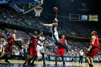 EAST RUTHERFORD, NJ - MAY 04:  Vince Carter #15 of the New Jersey Nets dunks against Chris Bosh #4 of the Toronto Raptors in Game Six of the Eastern Conference Quarterfinals during the 2007 NBA Playoffs on May 4, 2007 at the Continental Airlines Arena at 