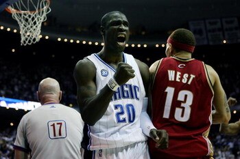 ORLANDO, FL - MAY 24:  Mickael Pietrus #20 of the Orlando Magic celebrates drawing a sixth foul from Delonte West #13 of the Cleveland Cavaliers in Game Three of the Eastern Conference Finals during the 2009 NBA Playoffs at the the Amway Arena on May 24, 