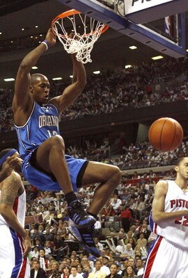 AUBURN HILLS, MI - APRIL 21:  Dwight Howard #12 of the Orlando Magic dunks in front of Tayshaun Prince #22 and Rasheed Wallace #36 of the Detroit Pistons in game one of the Eastern Conference Quarterfinals during the 2007 NBA Playoffs at the Palace of Aub