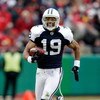 KANSAS CITY, MO - OCTOBER 11:  Miles Austin #19 of the Dallas Cowboys breaks a tackle and continues to the endzone for the first of his two touchdowns during the game against the Kansas City Chiefs on October 11, 2009 at Arrowhead Stadiumin Kansas City, M