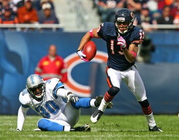 CHICAGO - OCTOBER 04: Johnny Knox #13 of the Chicago Bears runs past Ko Simpson #30 of the Detroit Lions on October 4, 2009 at Soldier Field in Chicago, Illinois. The Bears defeated the Lions 48-24. (Photo by Jonathan Daniel/Getty Images)